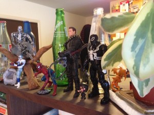 Schwarzenegger Terminator (left) and Agent Venom (right). Between them stands Edna Mode from Pixar's The Incredibles. Matt got her for me so I because she's eminently sensible as well as rather short