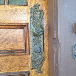 The acanthus leaves  at the top and bottom of the escutcheon are beautifully molded, giving the otherwise rectangular shape a fluid appearance.